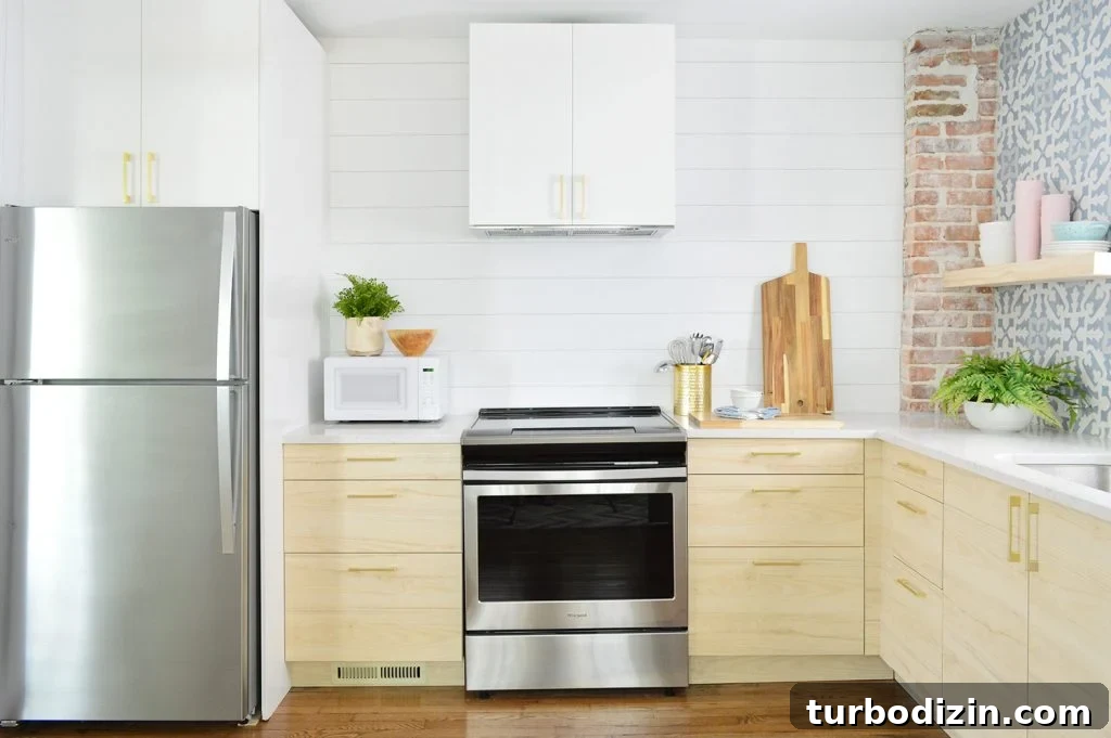 DIY Shiplap Wall Plank Makeover for $31 Total 3 White Planked Wall In Duplex Kitchen With Wood Shelves
