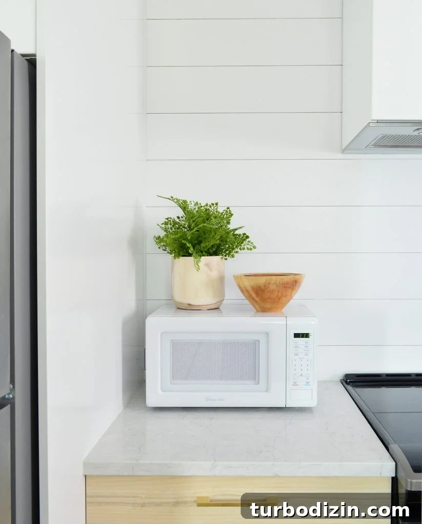 DIY Shiplap Wall Plank Makeover for $31 Total 27 Detail Of Planked Wall In Duplex Kitchen With Counter Microwave