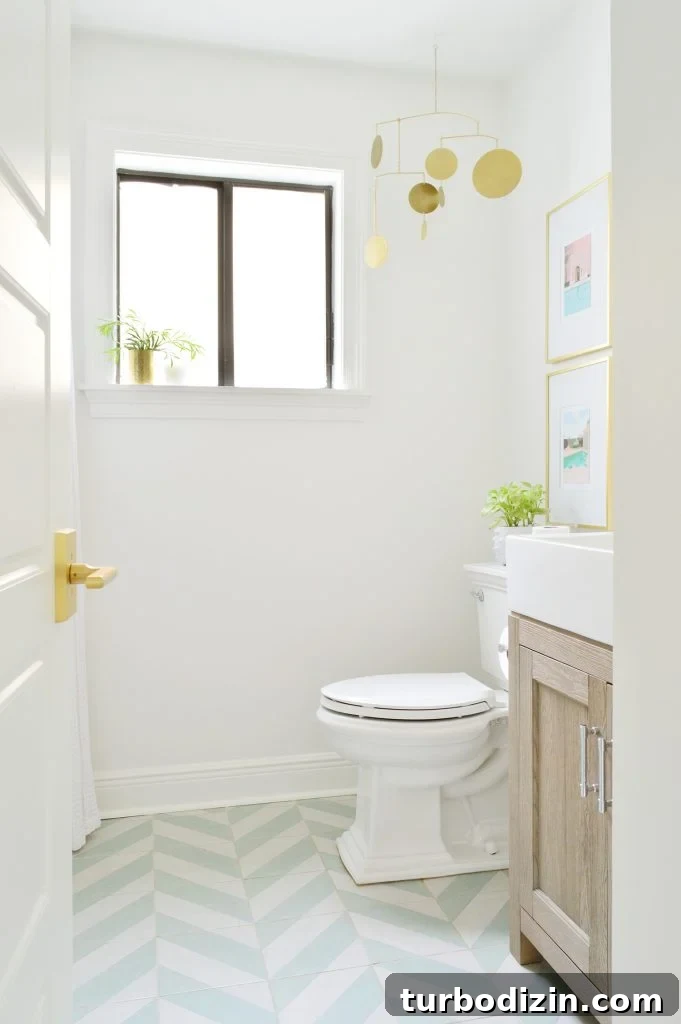 Open door to bathroom with green striped tile floor