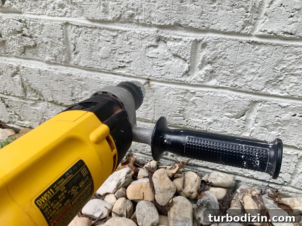 DIY Garden Trellis: Step-by-Step Guide to Build Your Own 14 Hammer Drilling Making Hole In Brick Wall