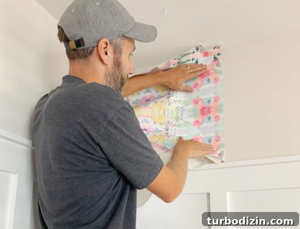 Placing First Panel Of Peel And Stick Wallpaper