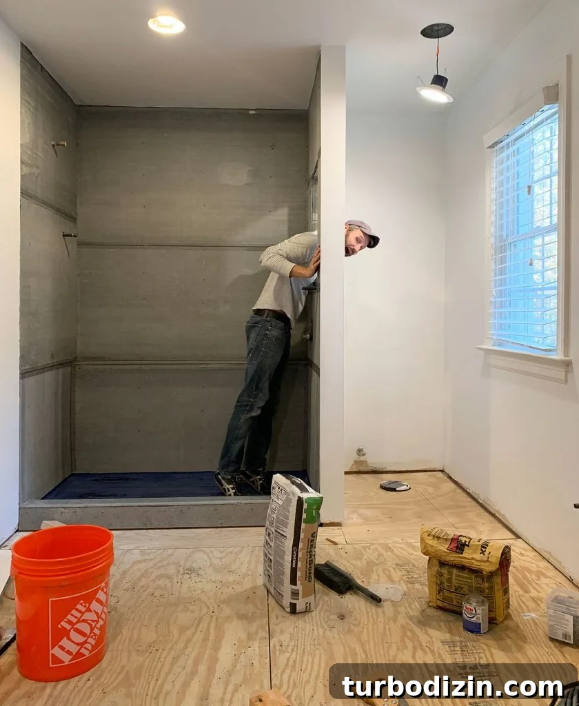Managing Renovation Stress: 5 Practical Tips for a Smoother Remodel 3 John Standing In Shower Mid Bathroom Renovation
