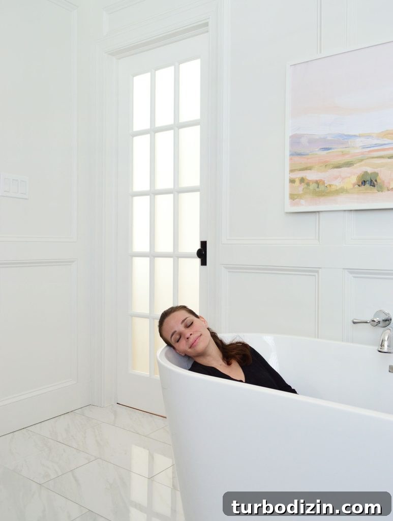 Managing Renovation Stress: 5 Practical Tips for a Smoother Remodel 5 Sherry Relaxing In Freestanding Stub In Renovated Bathroom