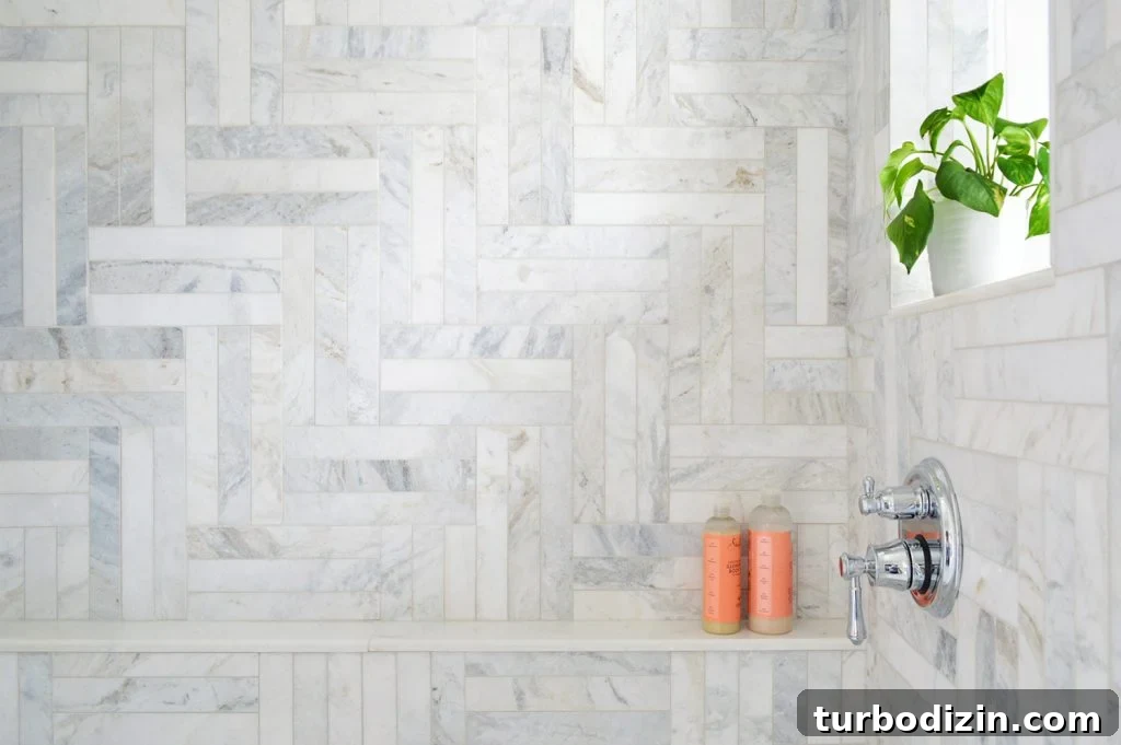 Managing Renovation Stress: 5 Practical Tips for a Smoother Remodel 8 Detail of Herringbone Marble Tile Shower With Shampoo Ledge