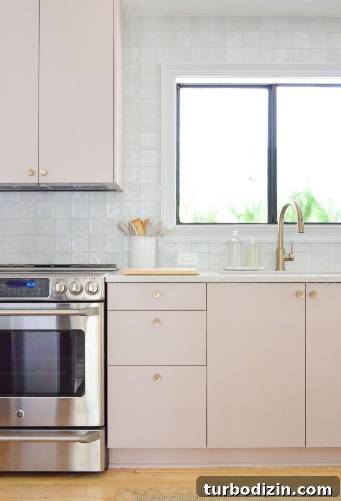 Managing Renovation Stress: 5 Practical Tips for a Smoother Remodel 10 Vertical View Of Mauve Pink Painted Ikea Kitchen Cabinets With Gray Tile Backsplash