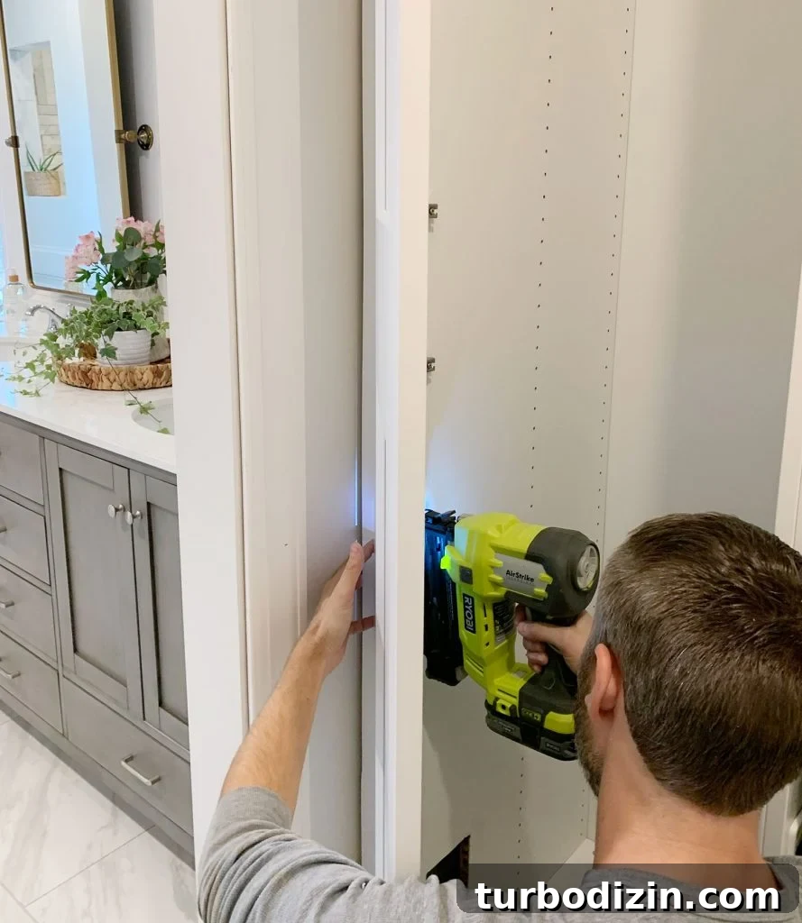 John Nailing Side Of Ikea Pax Wardrobe To Look Built In