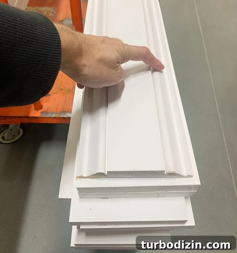 How to Install Decorative Wall Molding for a Polished Look 3 Decorative Wall Molding Trim Arranged On Shopping Cart