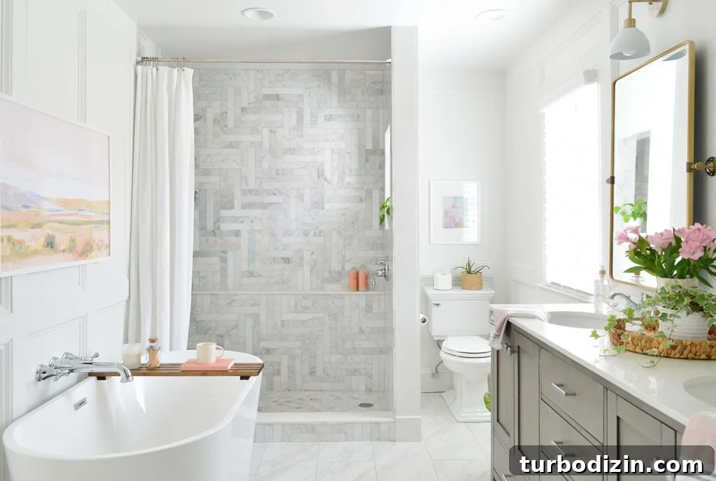 Bathroom Makeover Before and After Photos + Exact Cost Breakdown 2 Marble Bathroom With Herringbone Tile Walk In Shower And Freestanding Tub