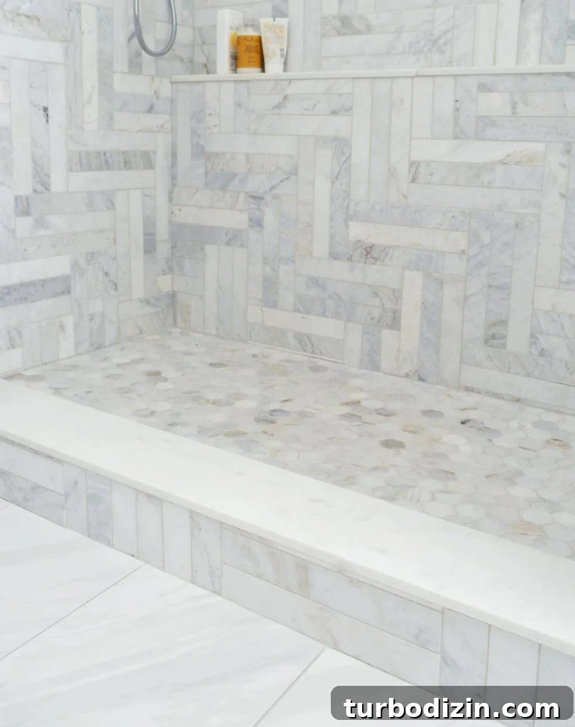 Bathroom Makeover Before and After Photos + Exact Cost Breakdown 12 Marble Herringbone Modern Pattern In Walk In Shower With Hex Tile Floor
