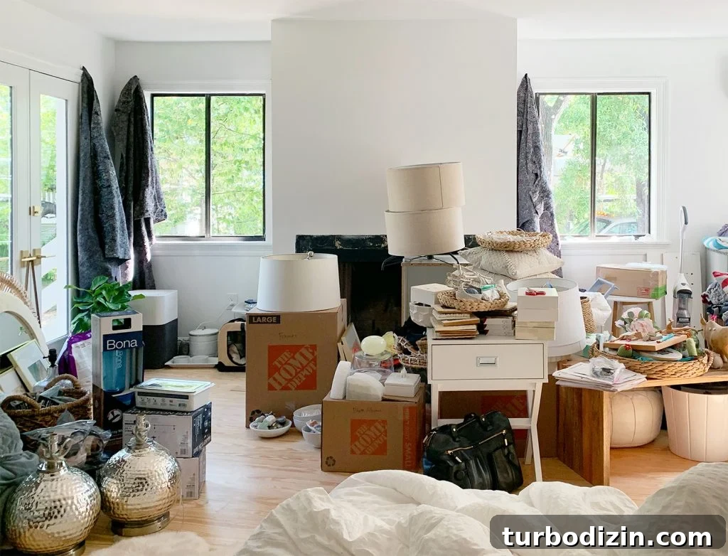 Mess of moving boxes in bedroom on first day
