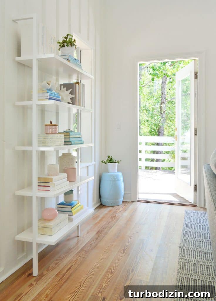Our Upstairs Family Room After Four Weeks: What Changed and Why 12 Floating White Bookcase With Door Open To Deck