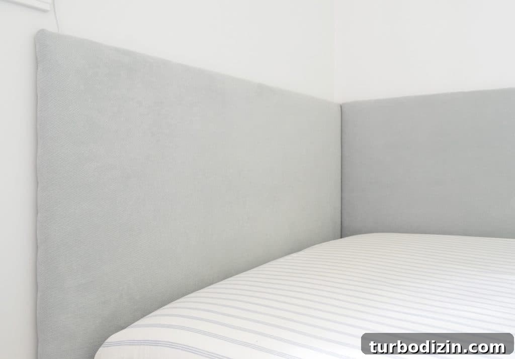 Simple DIY Headboard Ideas to Build Yourself in a Weekend 15 Close up of finished DIY headboard on two sides of built-in daybed in boys bedroom
