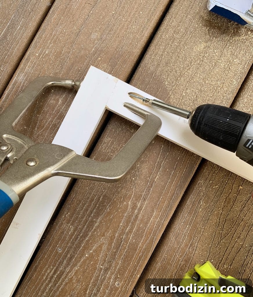 Simple DIY Headboard Ideas to Build Yourself in a Weekend 7 Close up of pocket hole joinery using Kreg Jig clamp