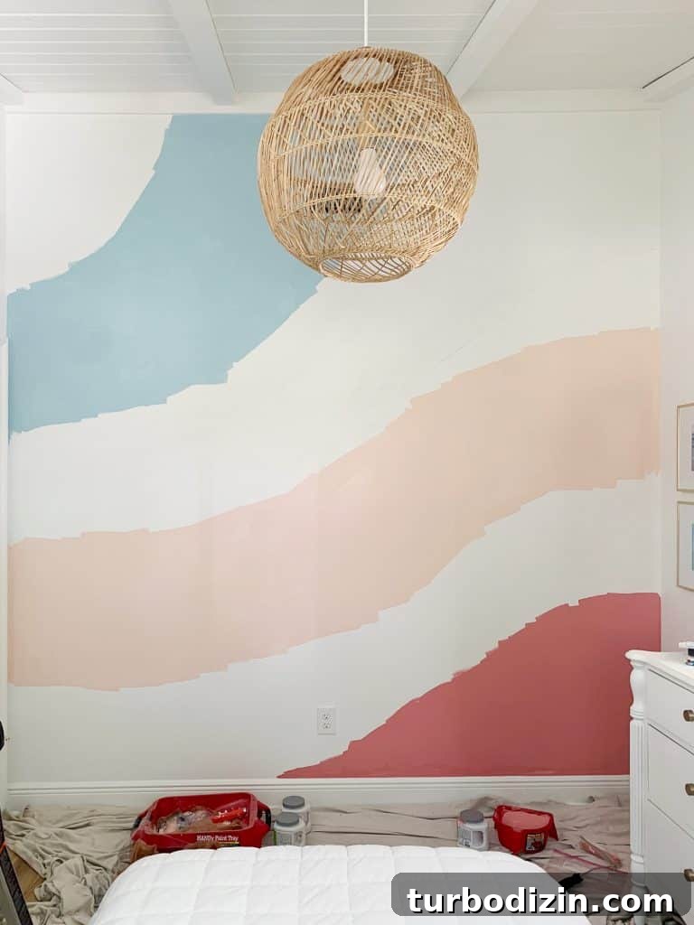 How to Paint a DIY Wall Mural: Step-by-Step Guide for Home Walls 12 First three stripes painted in abstract wall mural in girls room.