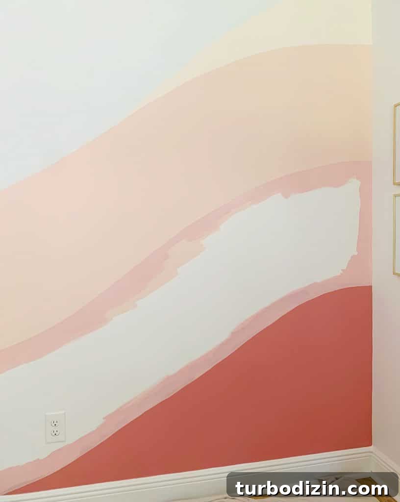How to Paint a DIY Wall Mural: Step-by-Step Guide for Home Walls 13 Crisp edges of pink paint between two colors on abstract wall mural