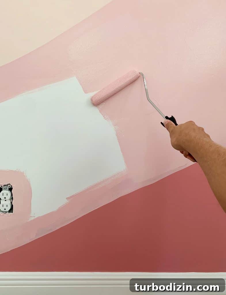 How to Paint a DIY Wall Mural: Step-by-Step Guide for Home Walls 14 Filling in abstract mural with paint roller