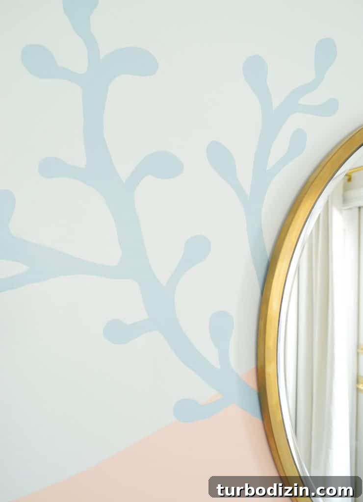 How to Paint a DIY Wall Mural: Step-by-Step Guide for Home Walls 18 Blue coral shape painted onto abstract mural in beachy girls bedroom
