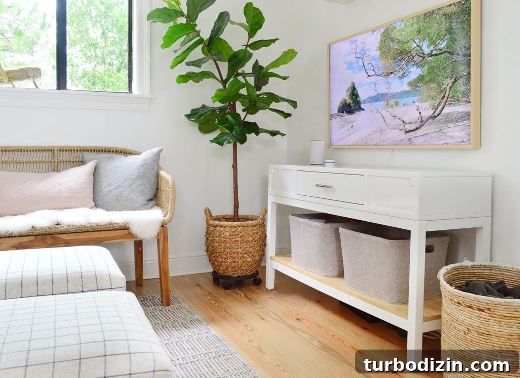 How We Hung a Massive Serena & Lily Chandelier in Our Home 11 White Media Console With Frame TV And Woven Accessories