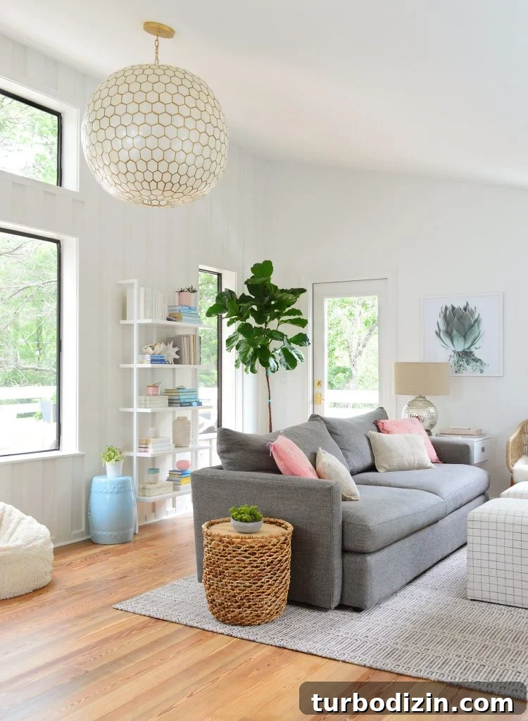 How We Hung a Massive Serena & Lily Chandelier in Our Home 3 Tall View Of Upstairs Family Room With Large Capiz Globe Light