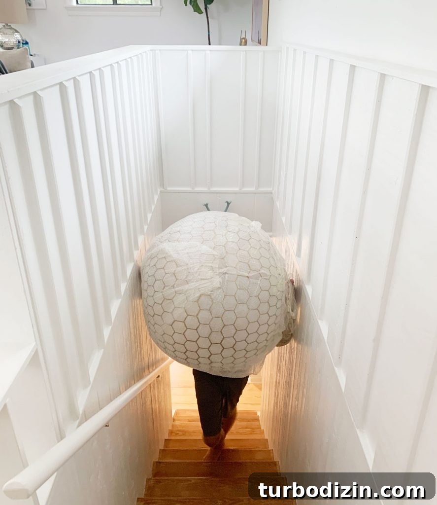 How We Hung a Massive Serena & Lily Chandelier in Our Home 5 Oversized Capiz Globe Light Narrowly Fitting Up Stairs