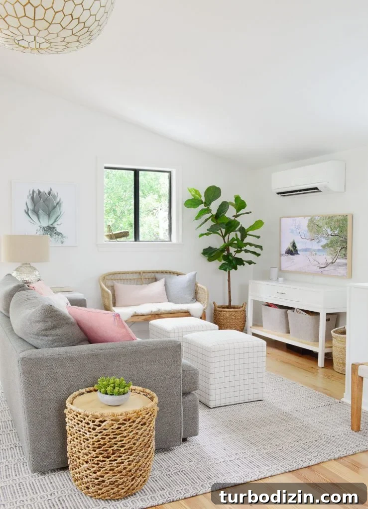 How We Hung a Massive Serena & Lily Chandelier in Our Home 8 TV Area With Couch Striped Ottomans And Woven Bench