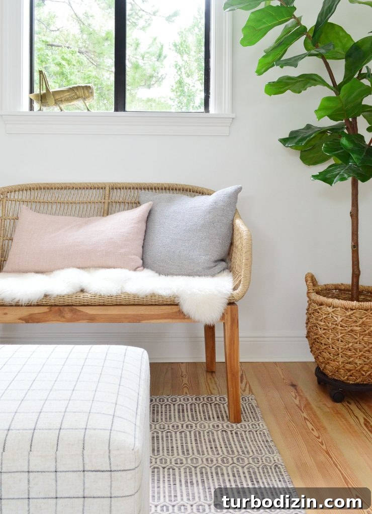 How We Hung a Massive Serena & Lily Chandelier in Our Home 10 Front View Of Woven Bench With Fluffy Base Pillows And Fig Tree