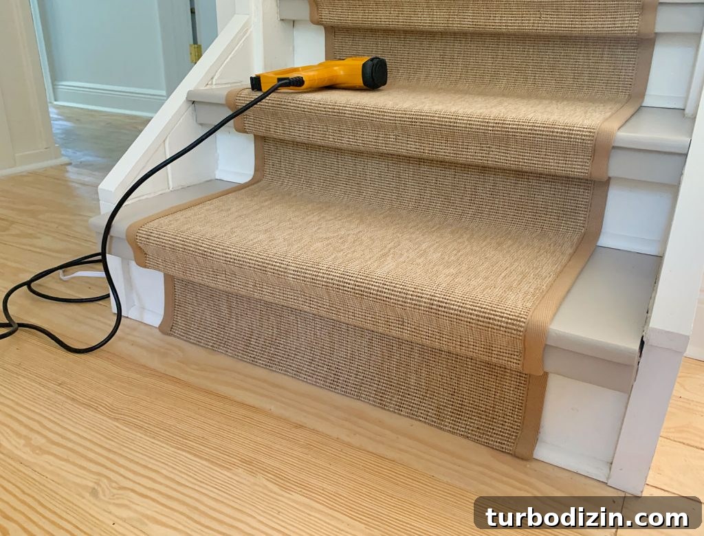 Bottom Step Of Staircase Showing Folded End Of Sisal Stair Runner