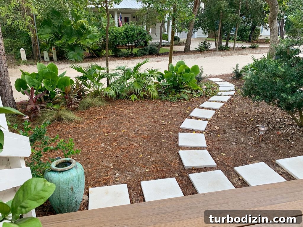Front Porch Ceiling Paint Ideas to Refresh Your Entryway 11 Pathway Of Square White Pavers Around Tropical Plantings
