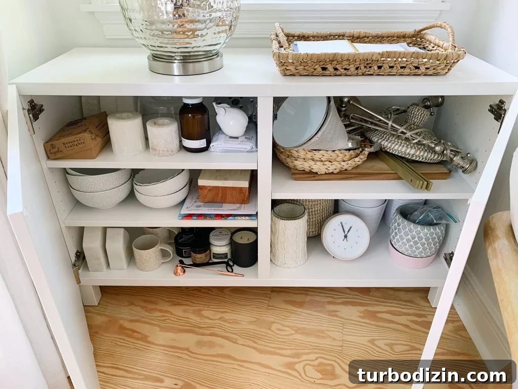Besta Cabinet Opened With Various Decor Accessories On Shelves