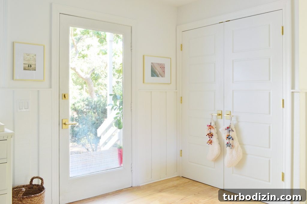 Holiday Decorating Ideas for Our Cozy Downsized Home 12 Front Door Next To Laundry Closet With Stockings On Handle
