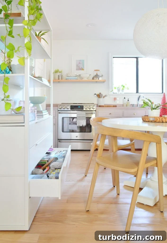 Our Kitchen and Sitting Area: Six Months of Living In 7 Drawer open on metal shelf behind round table