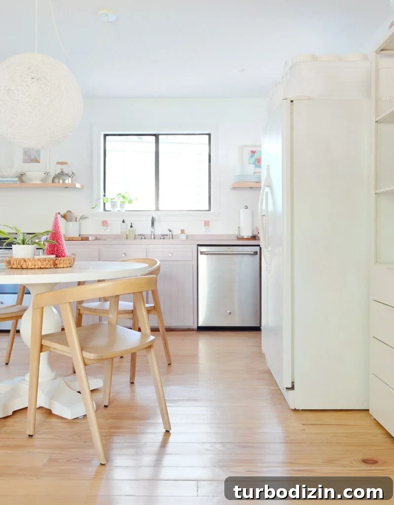 Our Kitchen and Sitting Area: Six Months of Living In 8 Gap between refrigerator and table in kitchen with mauve cabinets