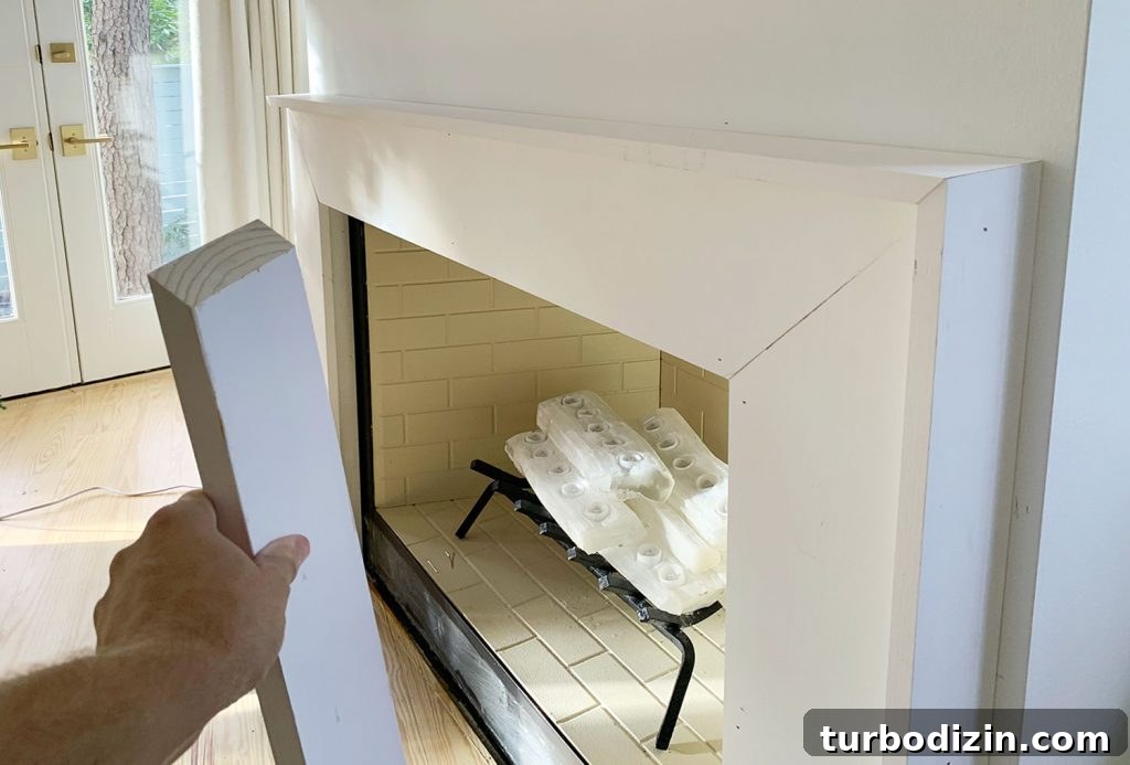 Modern Fireplace Mantel Ideas: Step-by-Step Build Guide 17 Side View Of Outside Trim Pieces Added Around Mantel Using Angled Miter Cuts