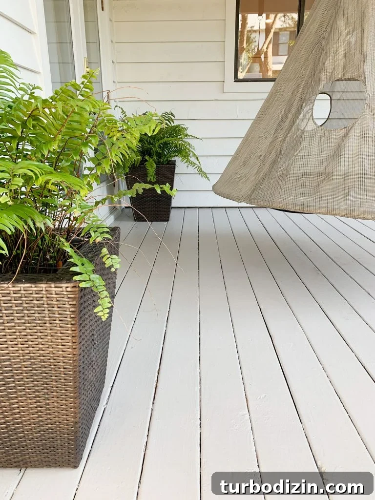 Finished painted gray porch floor detail