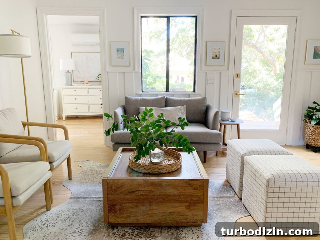 Small Loveseat Ideas for a Cozy Sitting Room 8 Sitting area including wood coffee table two plaid ottomans two arm chairs and gray loveseat