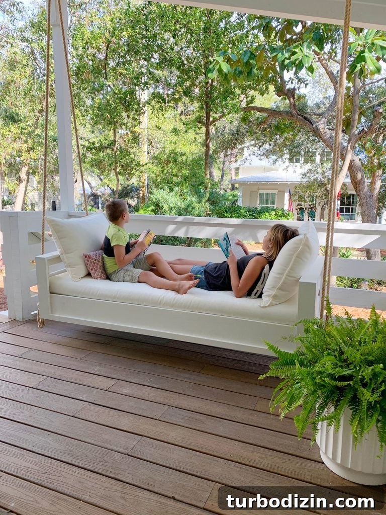 How to Build a Hanging Daybed: Step-by-Step Guide for Your Patio 2 Two Kids Reading On Either End Of White Hanging Daybed Swing