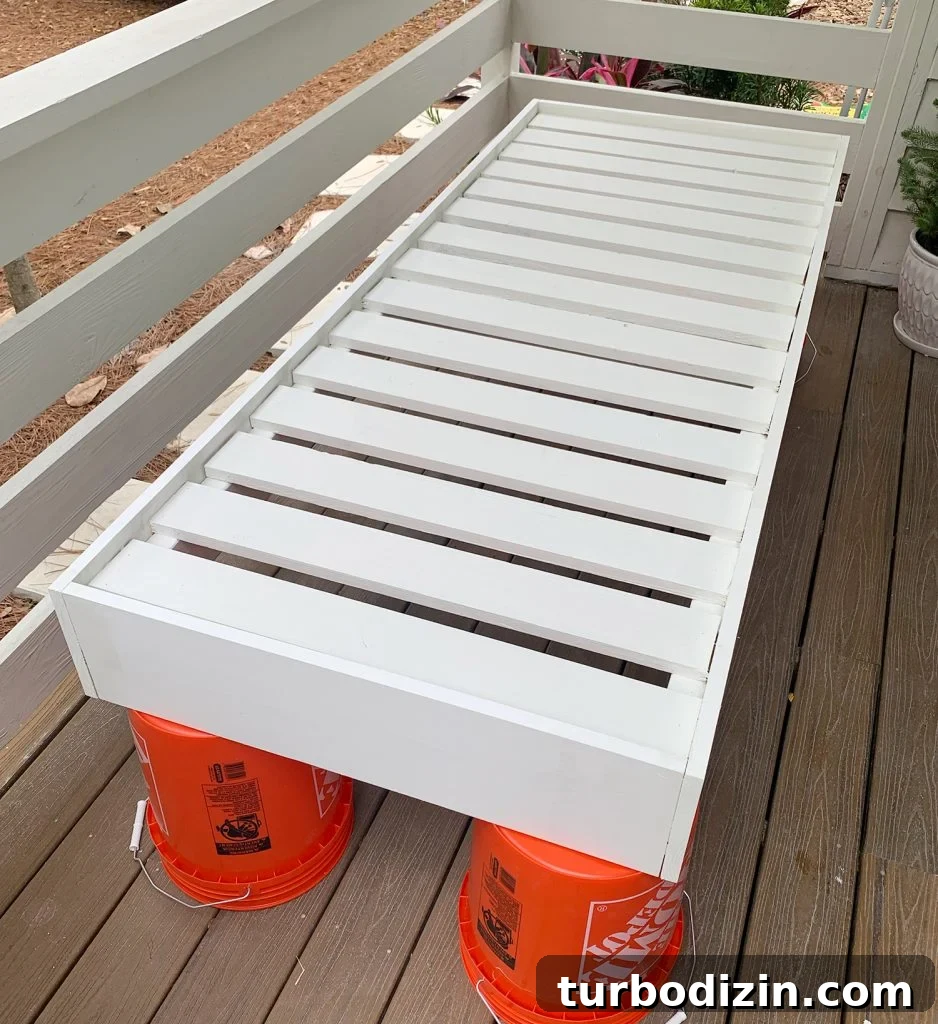 How to Build a Hanging Daybed: Step-by-Step Guide for Your Patio 14 Daybed frame fully constructed and painted white