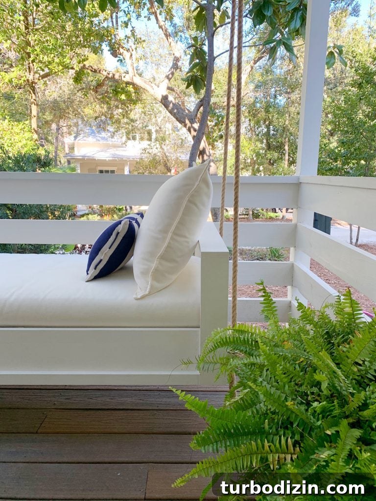 How to Build a Hanging Daybed: Step-by-Step Guide for Your Patio 20 Side View Of Finished White Hanging Daybed With Cream Cushion