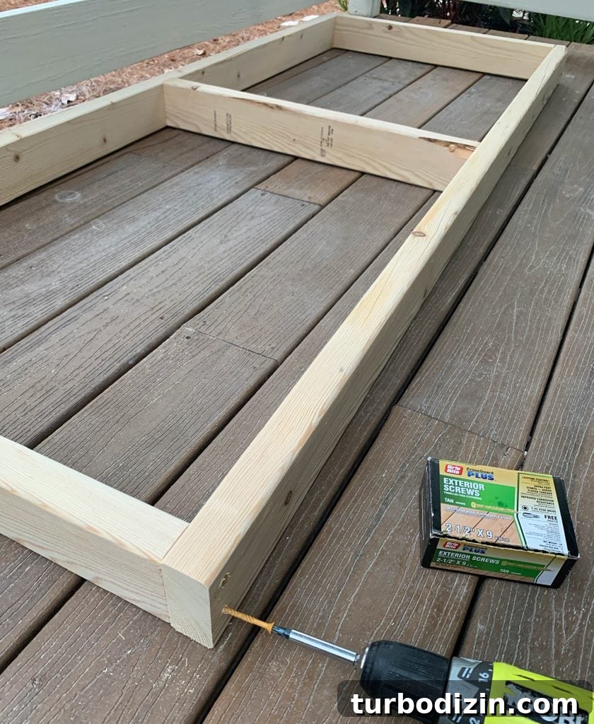 How to Build a Hanging Daybed: Step-by-Step Guide for Your Patio 10 Screwing 2x4 wood frame together for hanging daybed