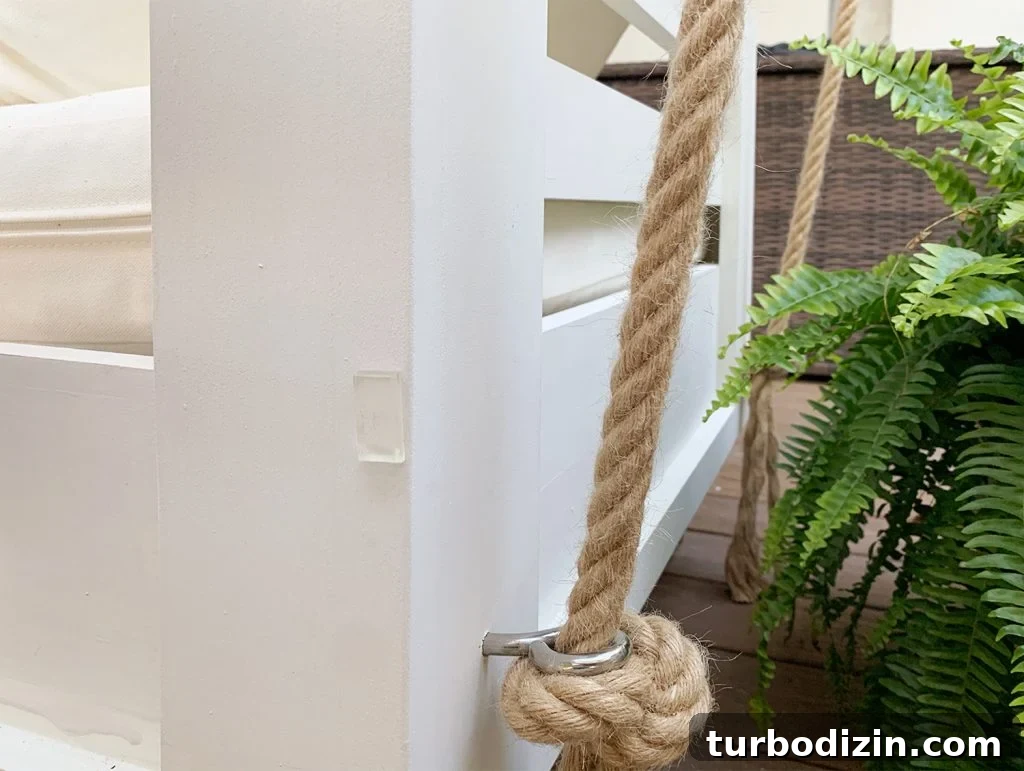 How to Hang an Outdoor Daybed: Step-by-Step Video Guide 11 Clear furniture bumper on backside of white hanging daybed