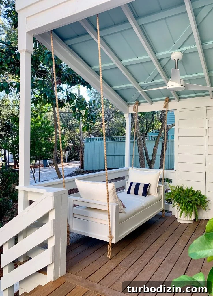 How to Hang an Outdoor Daybed: Step-by-Step Video Guide 12 Outdoor Hanging Daybed Hung With Rope In Four Spots Under Covered Porch Ceiling
