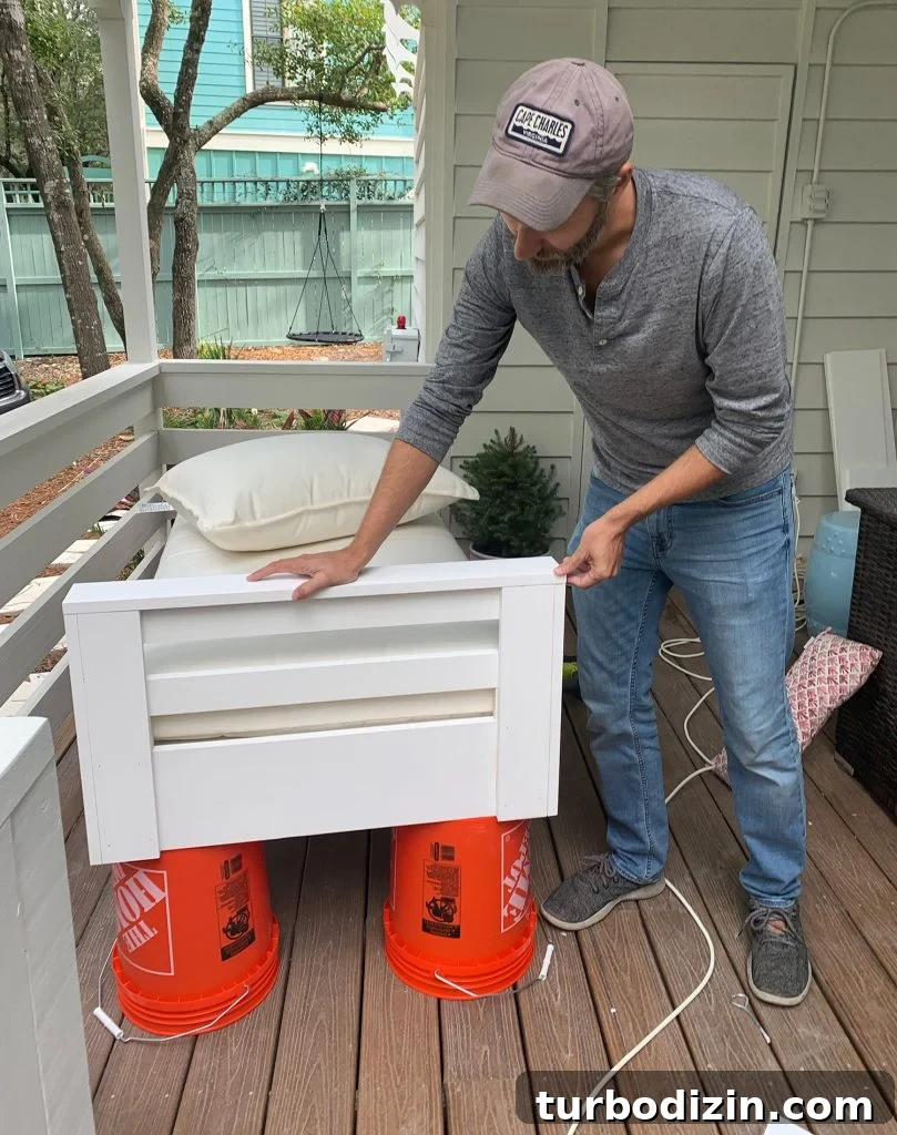 How to Hang an Outdoor Daybed: Step-by-Step Video Guide 5 John constructed one side arm on hanging daybed