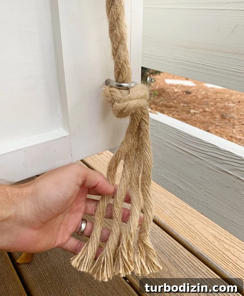 How to Hang an Outdoor Daybed: Step-by-Step Video Guide 9 Frayed rope under the bottom of daybed eye hook