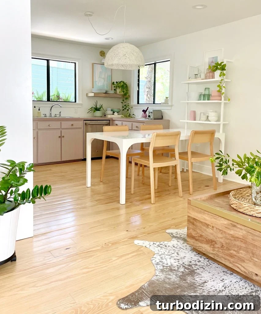 9 Smart Small Kitchen Ideas to Maximize Space and Style 11 Vertical View Of Walking Space To Beachy Kitchen With Wood Furniture And Mauve Cabinets