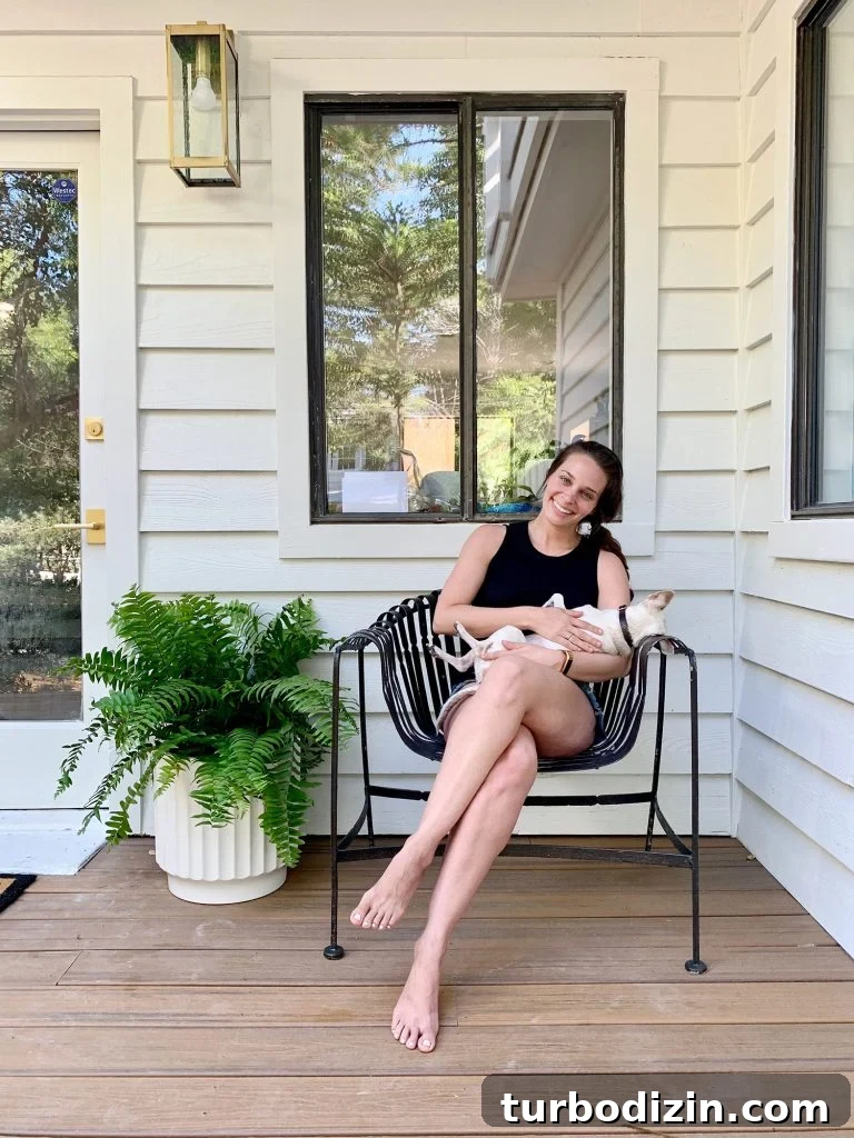 Celebrating the Classic Burger: History, Recipes, and Icons 17 Sherry holding Burger on front porch chair