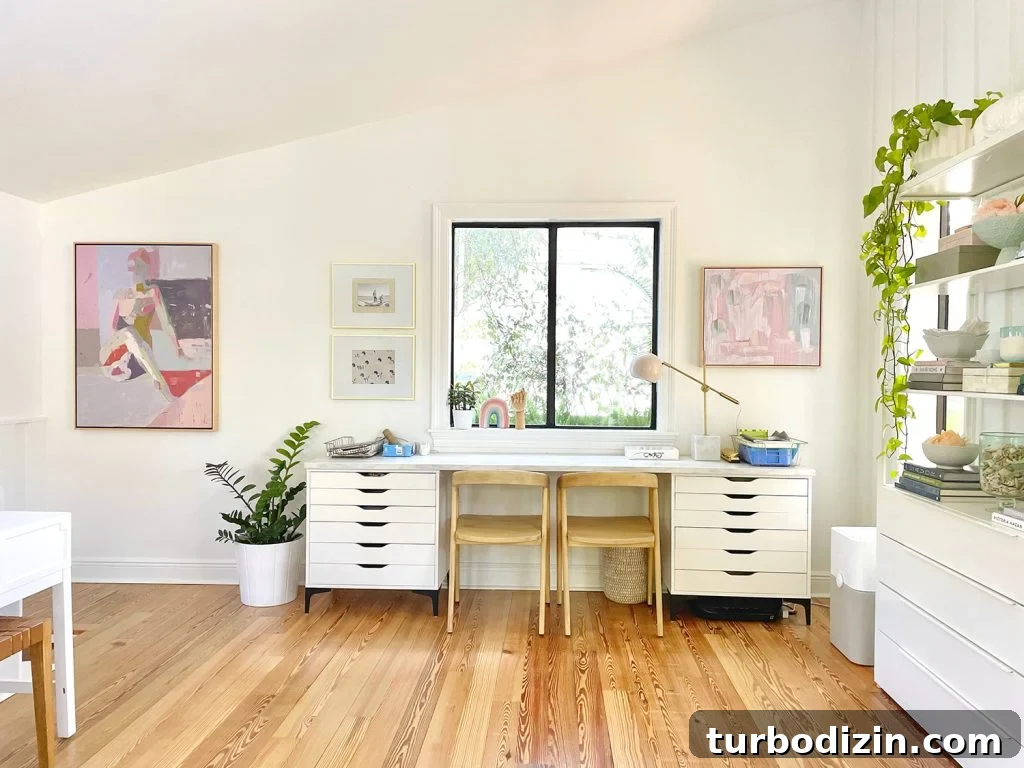 Family Room That Doubles as Office, Art Studio, and Home Theater 12 Kids Art Desk Under Window In Open Modern White Family Room With Faulted Ceilings And Artwork