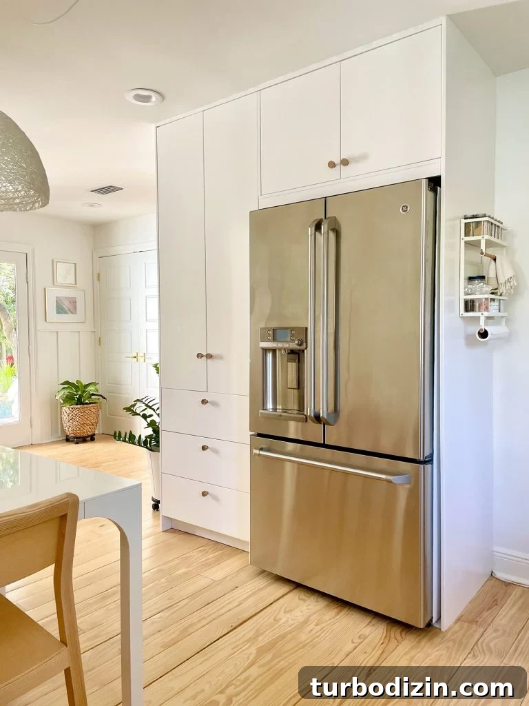 How to Add a Door to Your Kitchen: Design, Installation & Tips 9 Ikea Built-In Pantry Cabinets Around Stainless Steel Refrigerator