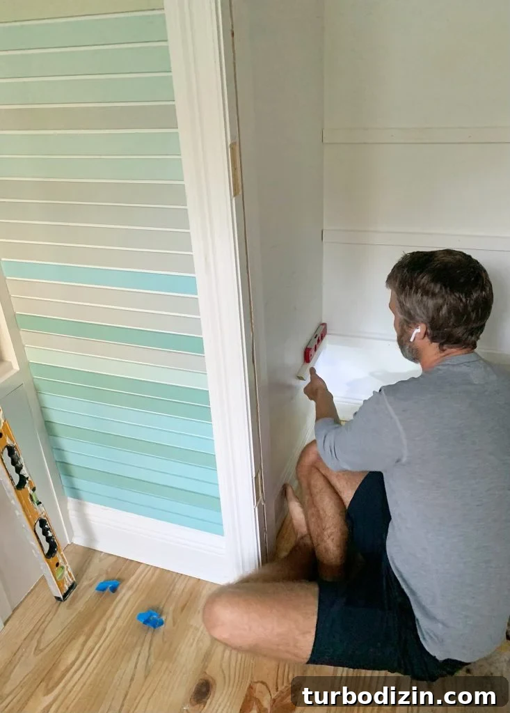 Smart Storage Solutions for a Small Kids' Bedroom 9 Adding Shelf Supports For DIY Closet Shelves With Level And Nail Gun
