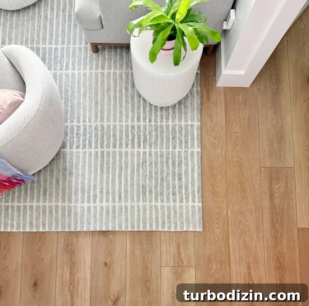 New Flooring FAQ: Answers About Installation, Care and Warranty 8 New LVP Floors Overhead With Blue Rug