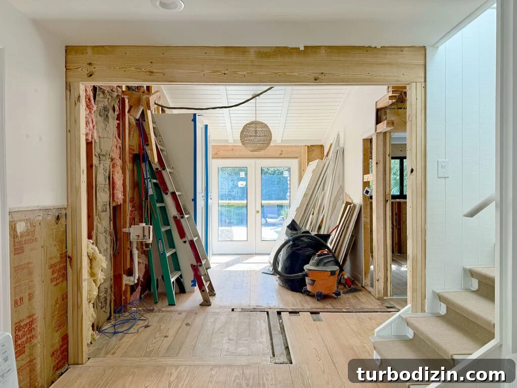 New Flooring FAQ: Answers About Installation, Care and Warranty 3 View Of Opened Wall To French Doors During Renovation